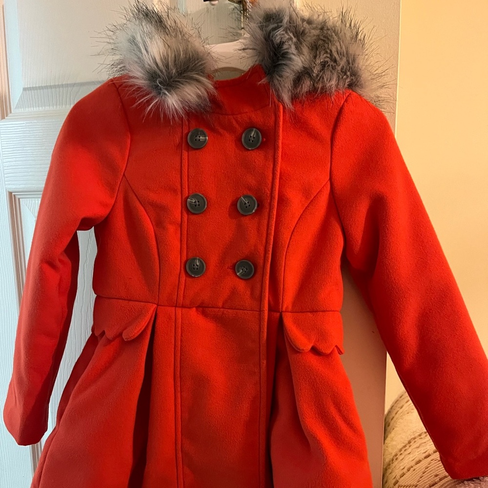 Girls Peplum peacoat with fur-lined hood.